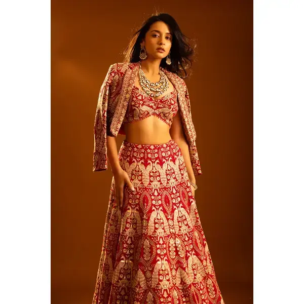 SEASONS-RED CLASSIC BRIDAL LEHENGA SET WITH ALL OVER PATTERNED THREAD WORK PAIRED WITH A MATCHING CROPPED JACKET AND SEQUIN DETAILS.